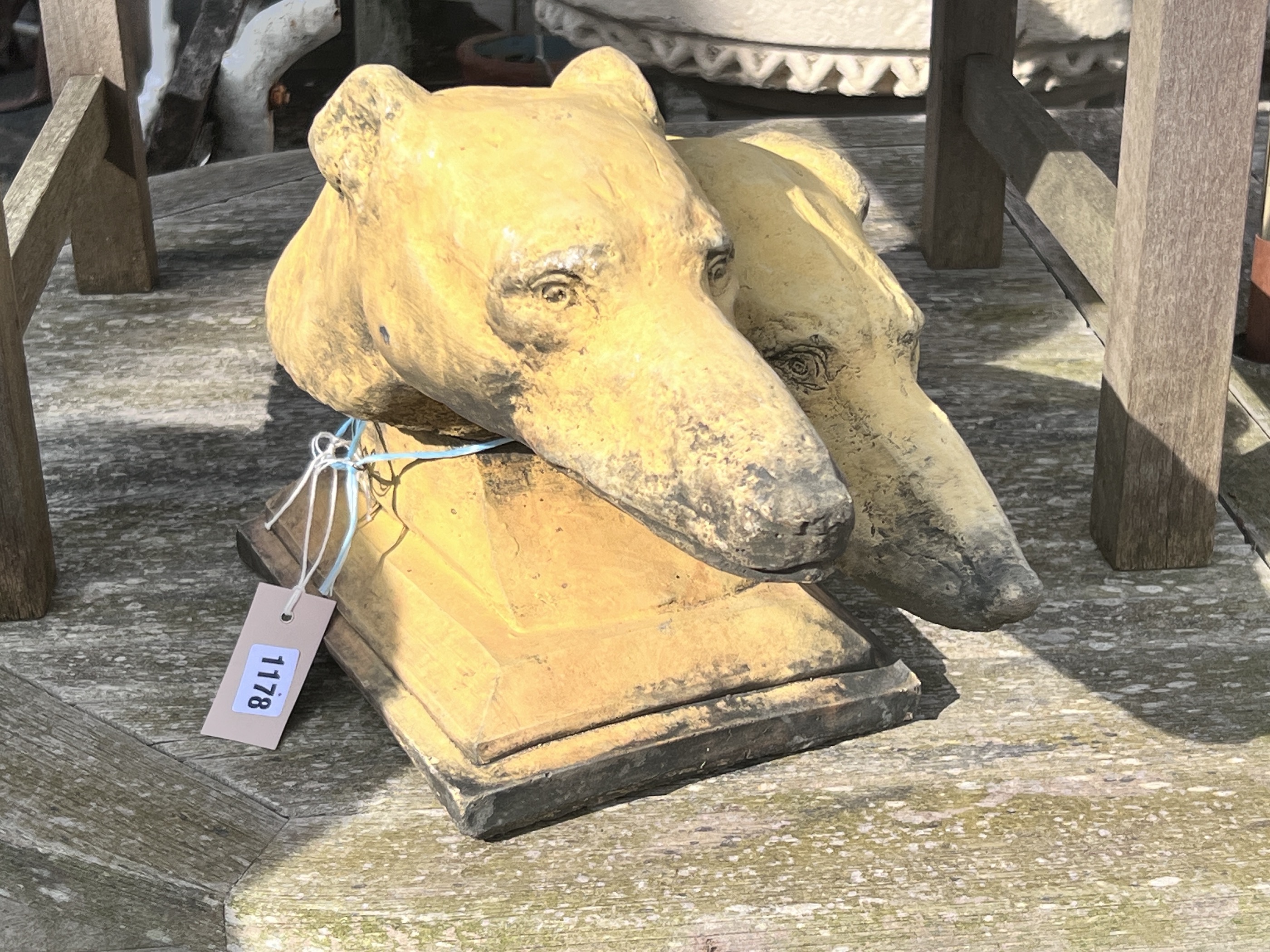 An Art Deco terracotta double Borzoi head finial, length 48cm